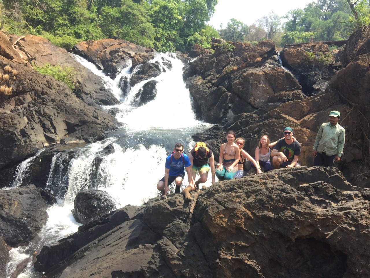 Tour group visiting a Mondulkiri waterfall with Mondulkiri Tour Guide